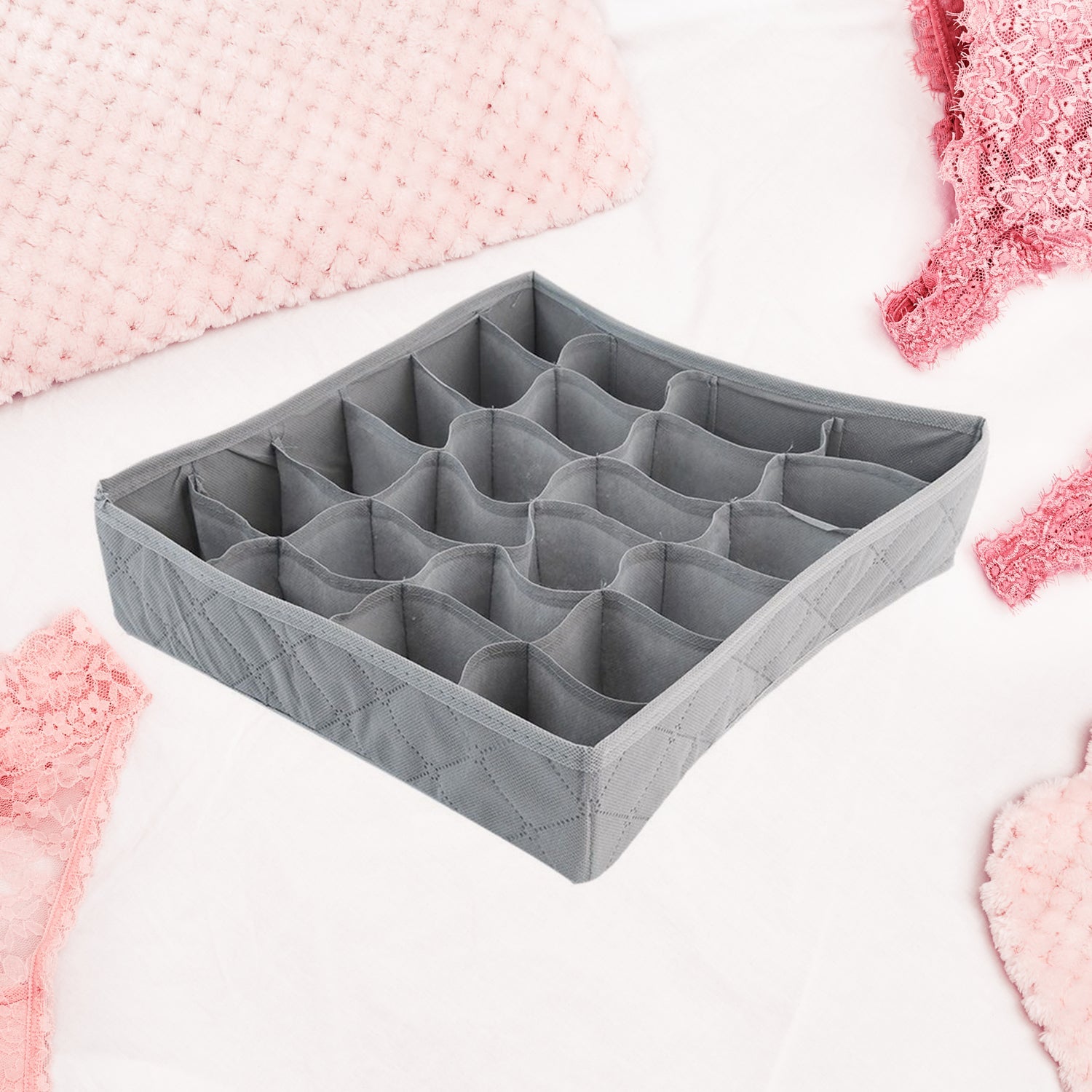 Folding storage box for ties, socks, and handkerchiefs. Folding storage box for ties, socks, and handkerchiefs.